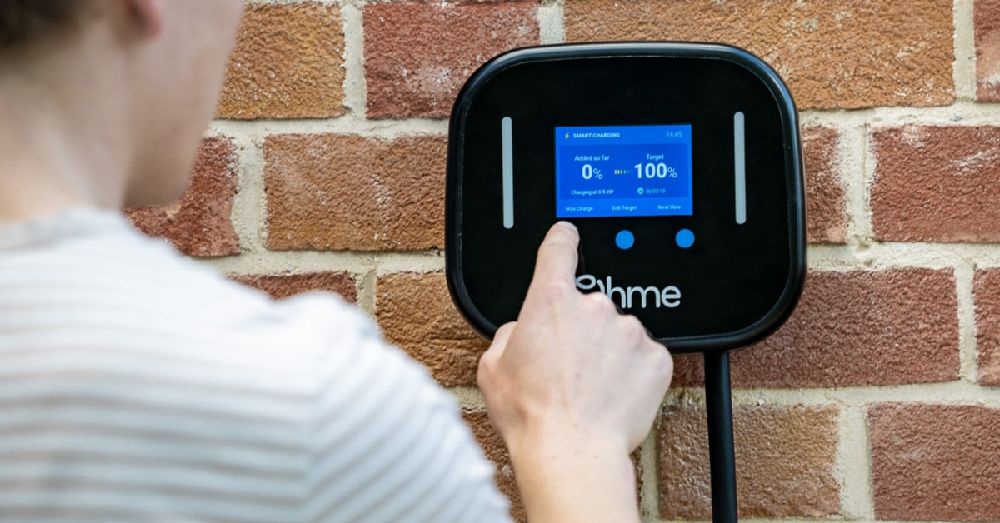 Adjusting settings on a home EV charger.